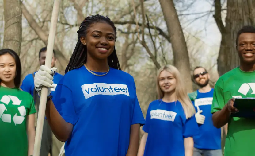 Gen Z volunteers stand ready to help clean up a site.