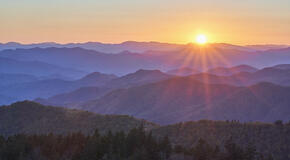 Sun rising over the blue ridge mountains