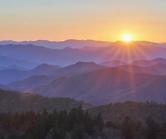 Sun rising over the blue ridge mountains