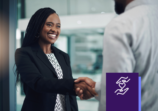 Black female professional shaking hands with coworker