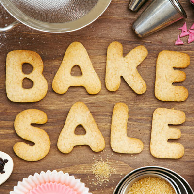 This photo of cookies spelling out “bake sale” captures the idea of the virtual bake sale fundraising event idea.