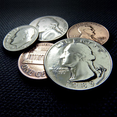 This photo of a pile of coins shows how small contributions add up in the give it up challenge fundraising event idea.