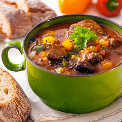 This photo of a bowl of chili and bread slices demonstrates the concept of the pop-up restaurant fundraising event idea for faith-based organizations.