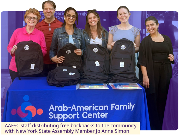 AAFSC staff distributing free backpacks to the community with New York State Assembly Member Jo Anne Simon