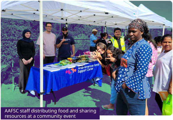 AAFSC staff distributing food and sharing resources at a community event