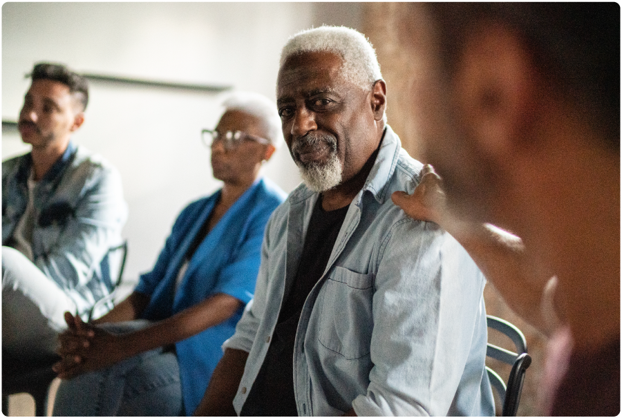 Photo of a man attending a support group meeting