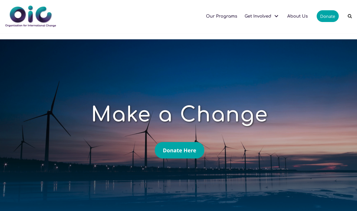 This image of Organization for International Change's homepage shows a donate button in its menu and on its hero image.