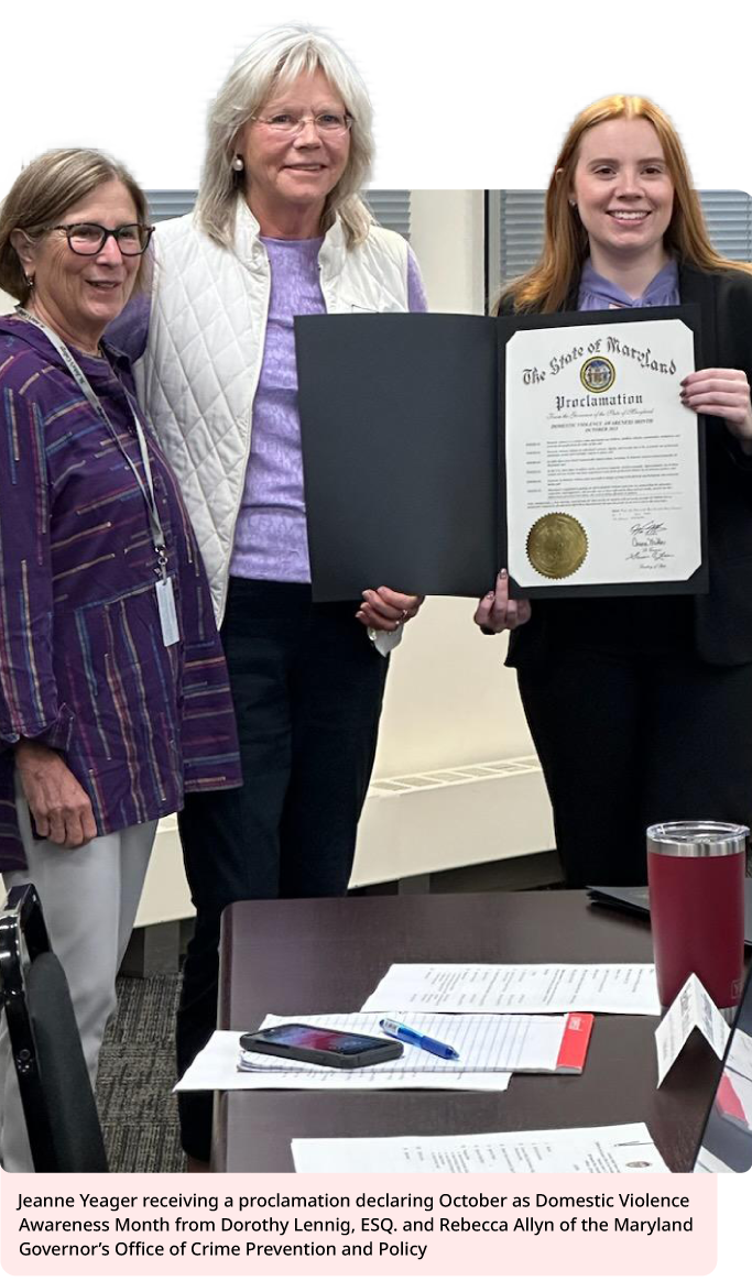 Jeanne Yeager receiving a proclamation declaring October as Domestic Violence Awareness Month from Dorothy Lennig, ESQ. and Rebecca Allyn of the Maryland Governor's Office of Crime Prevention and Policy