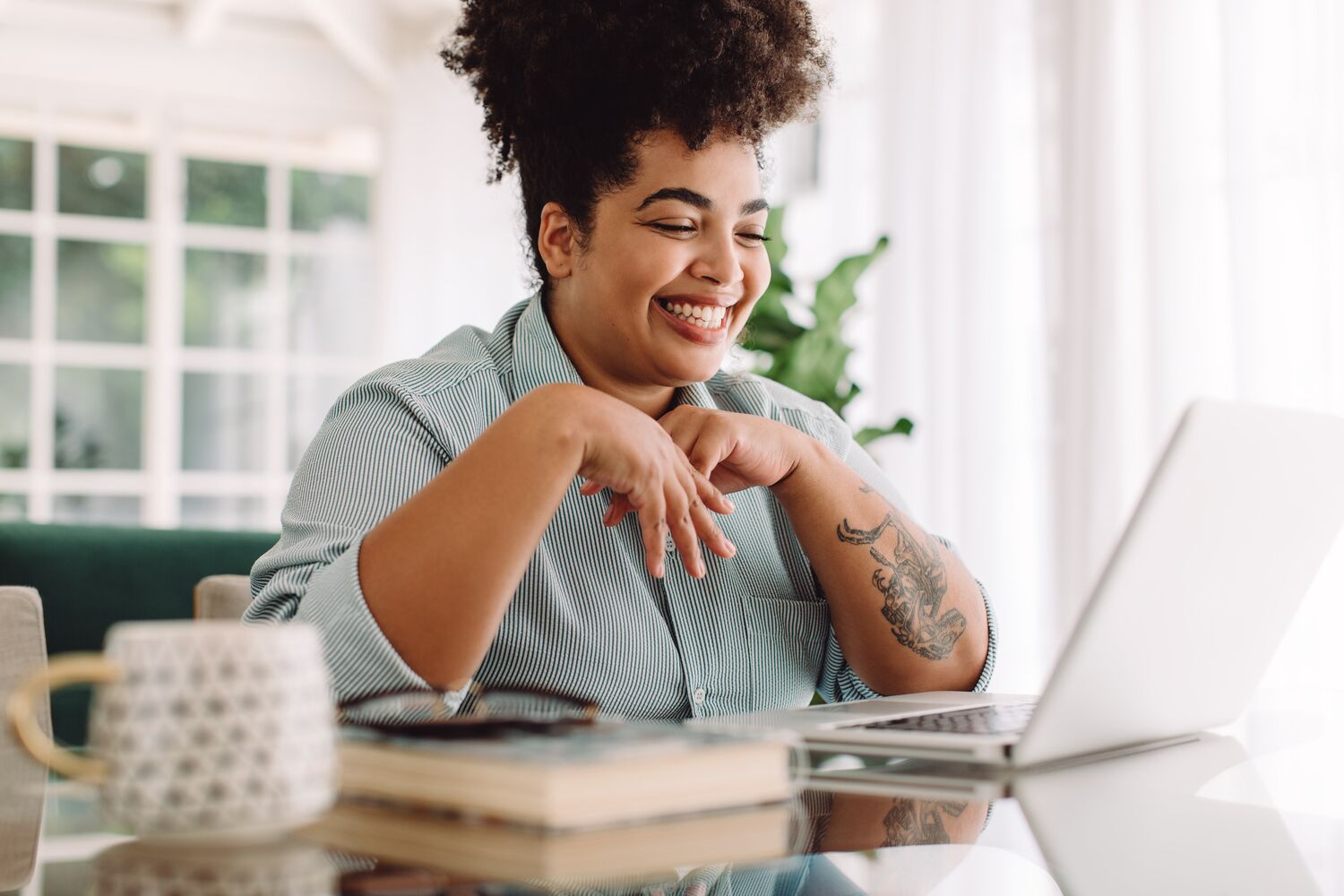 Woman having a virtual meeting on her laptop.