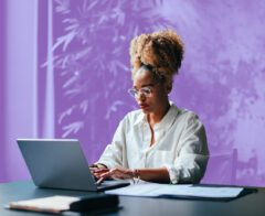 A photo of someone looking at a nonprofit reporting software dashboard.