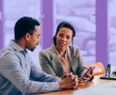 A person meeting with a financial advisor to discuss planned giving options.