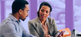 A person meeting with a financial advisor to discuss planned giving options.